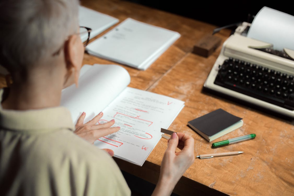 person reviewing marked work to learn from mistakes and improve future performance